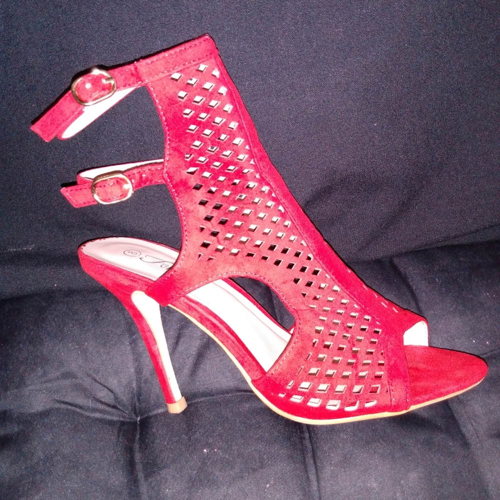Forever candy apple red, ankle-strapped stilettos.   Faux suede